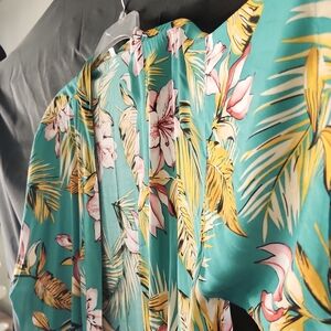 Lightweight, one size , tropical print cover up. No buttons or belt.